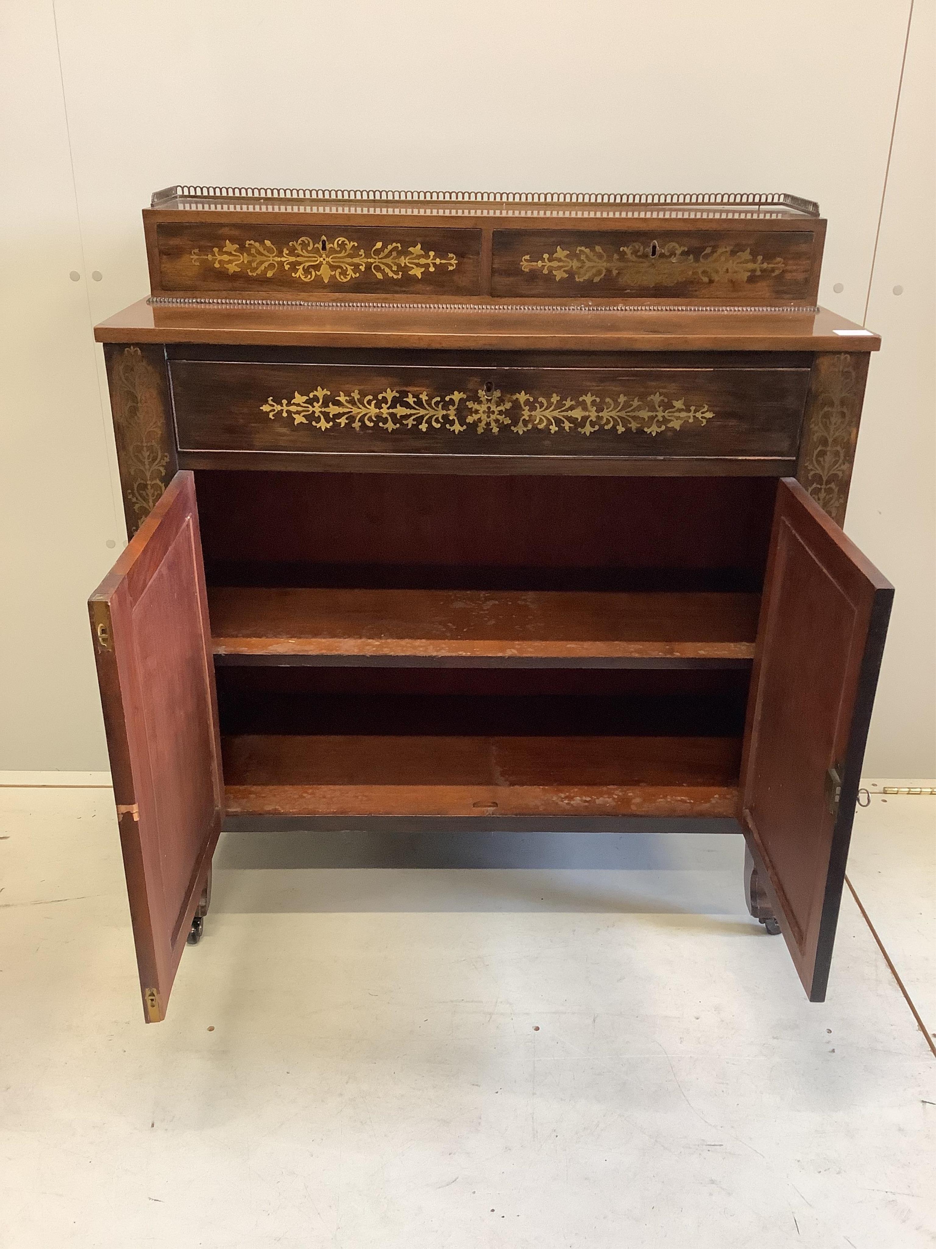 A Regency cut brass inlaid rosewood secretaire cabinet, width 93cm, depth 39cm, height 101cm. Condition - fair